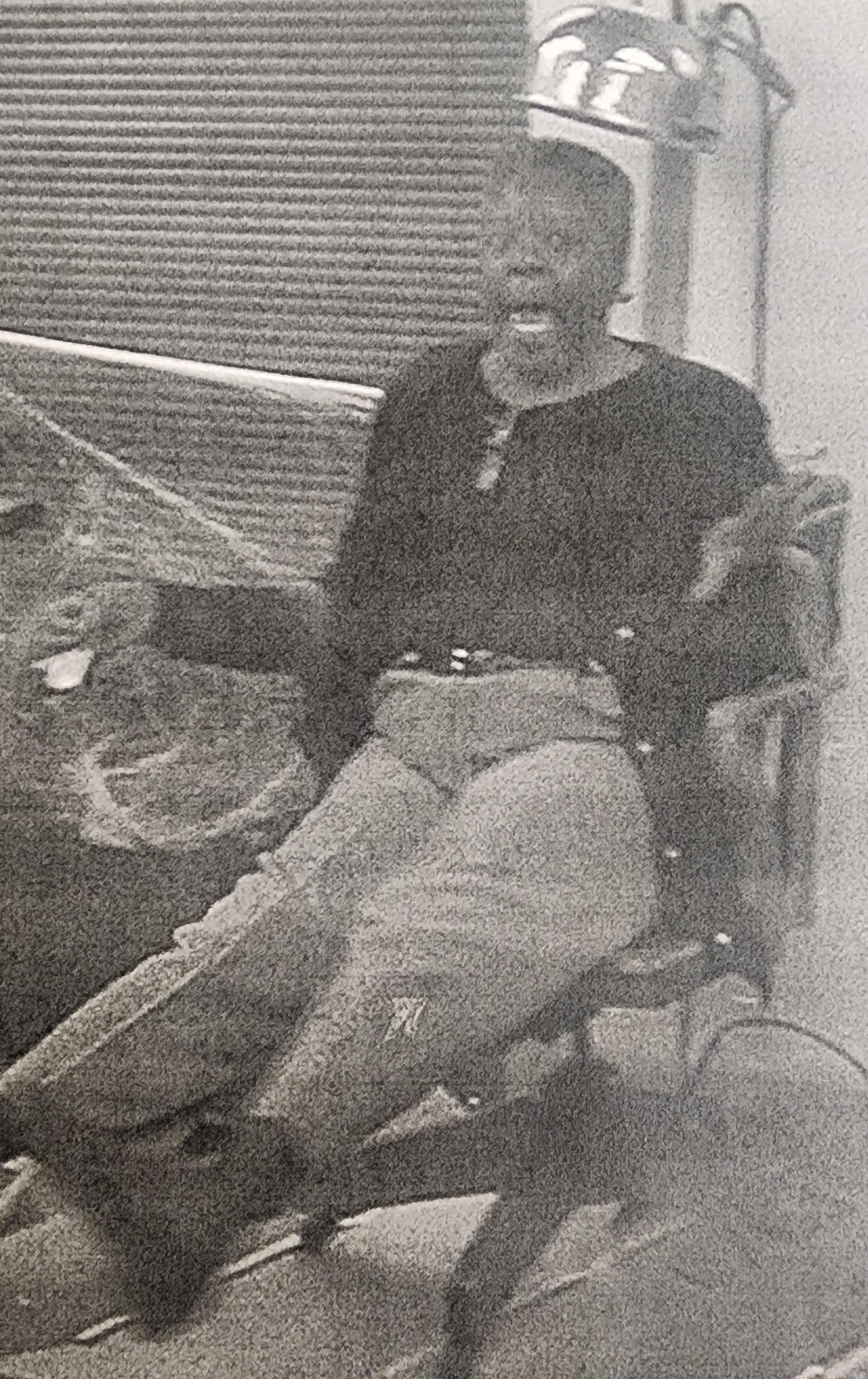 A person seated in a wheelchair shares their thoughts with visible passion in a relaxed environment.