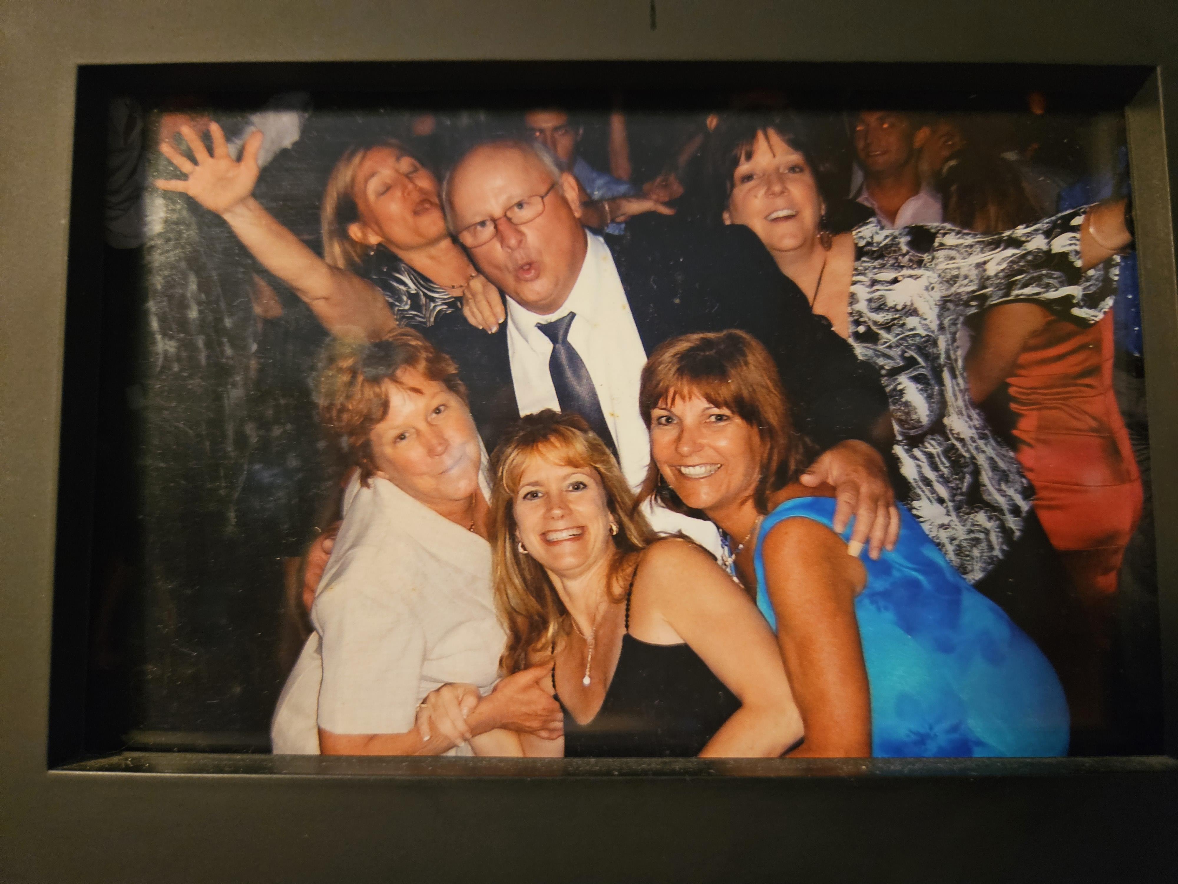 Friends gather for a vibrant celebration, enjoying music and laughter at a lively evening party.