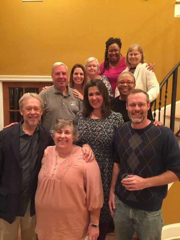 Friends share laughter and stories while enjoying a memorable evening together in a warm atmosphere.