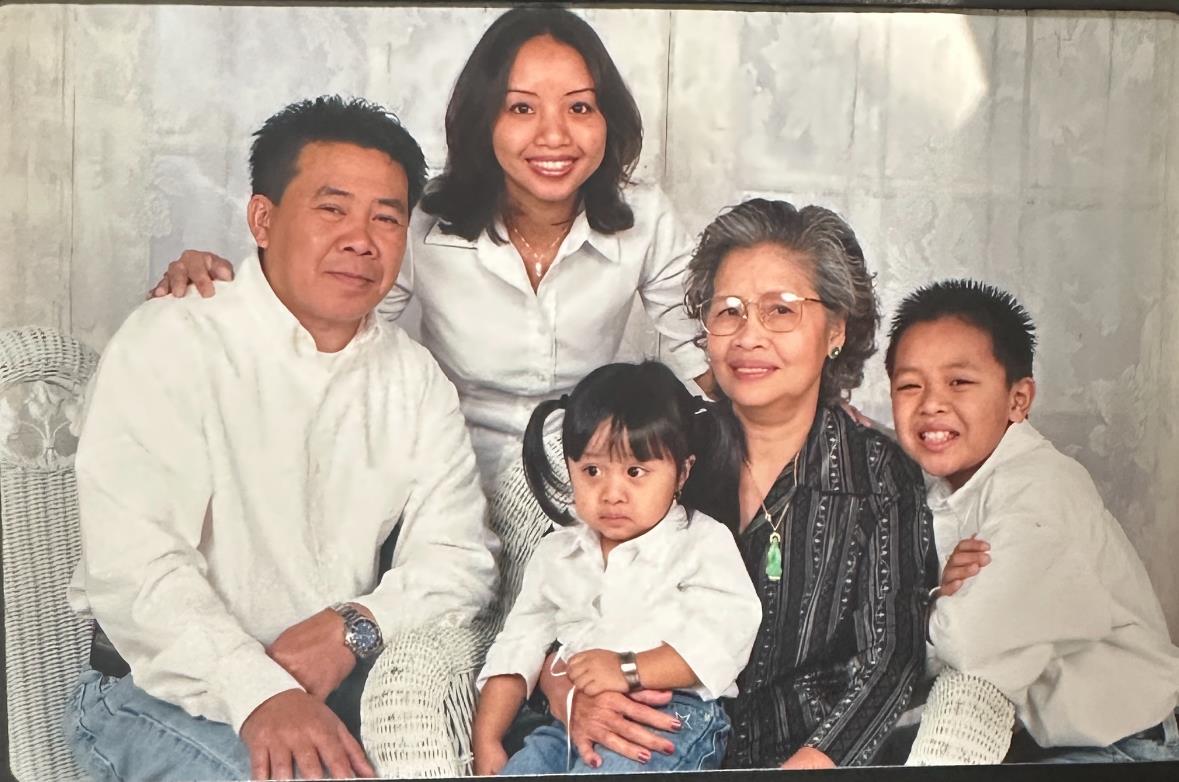 A family poses together, showcasing love and connection during a special gathering at home.