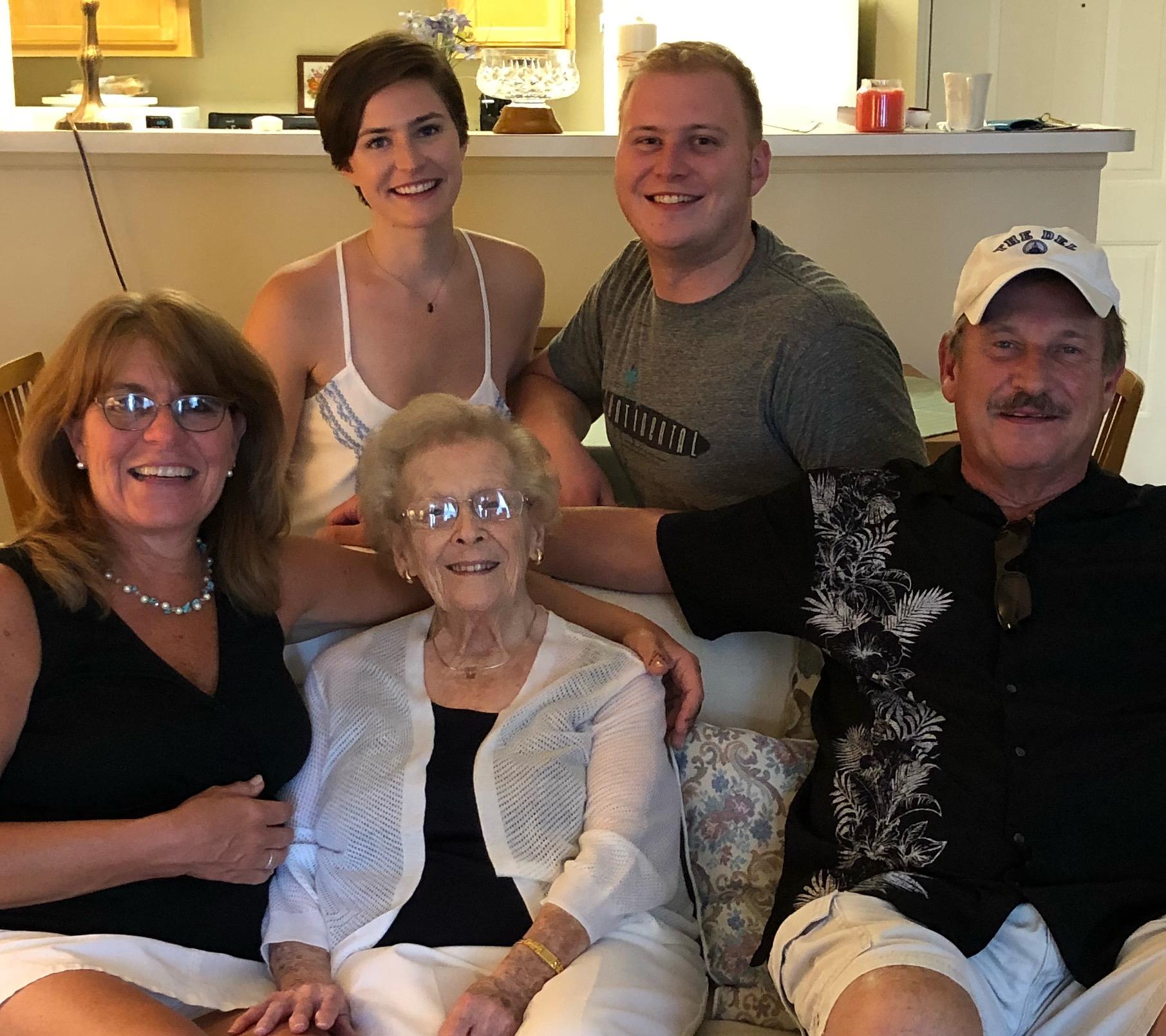 A warm family gathering features a cheerful group enjoying quality time together at home.