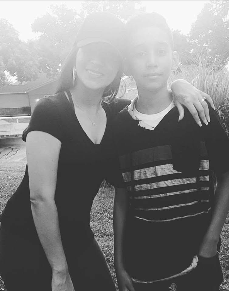 A woman and boy posing for a picture