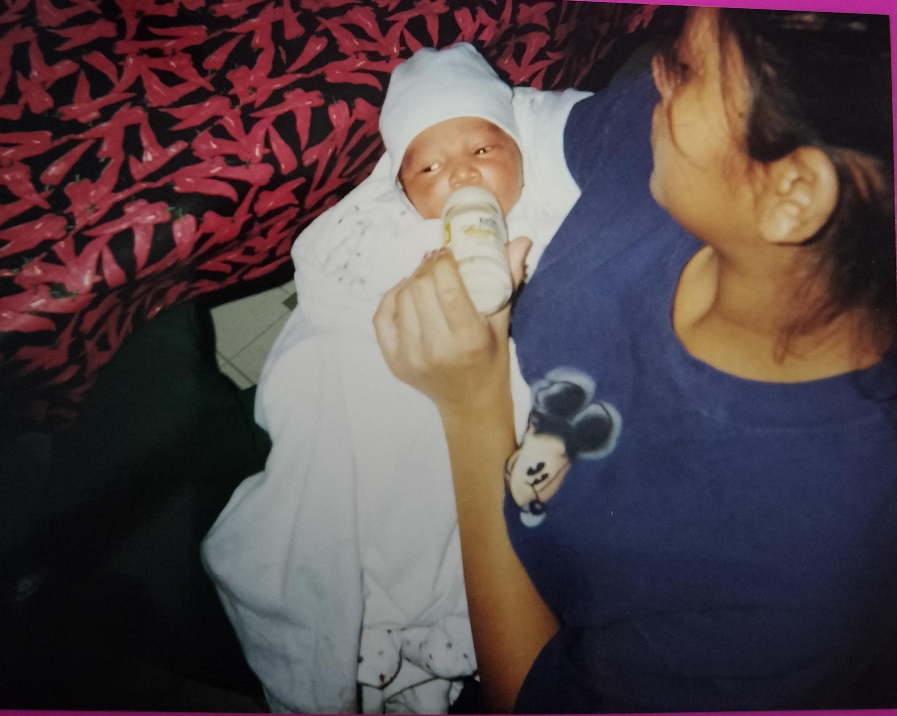 A woman holding a baby