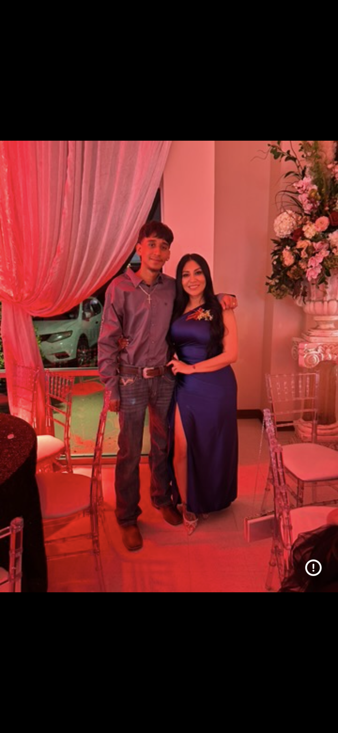 A man and woman posing for a picture