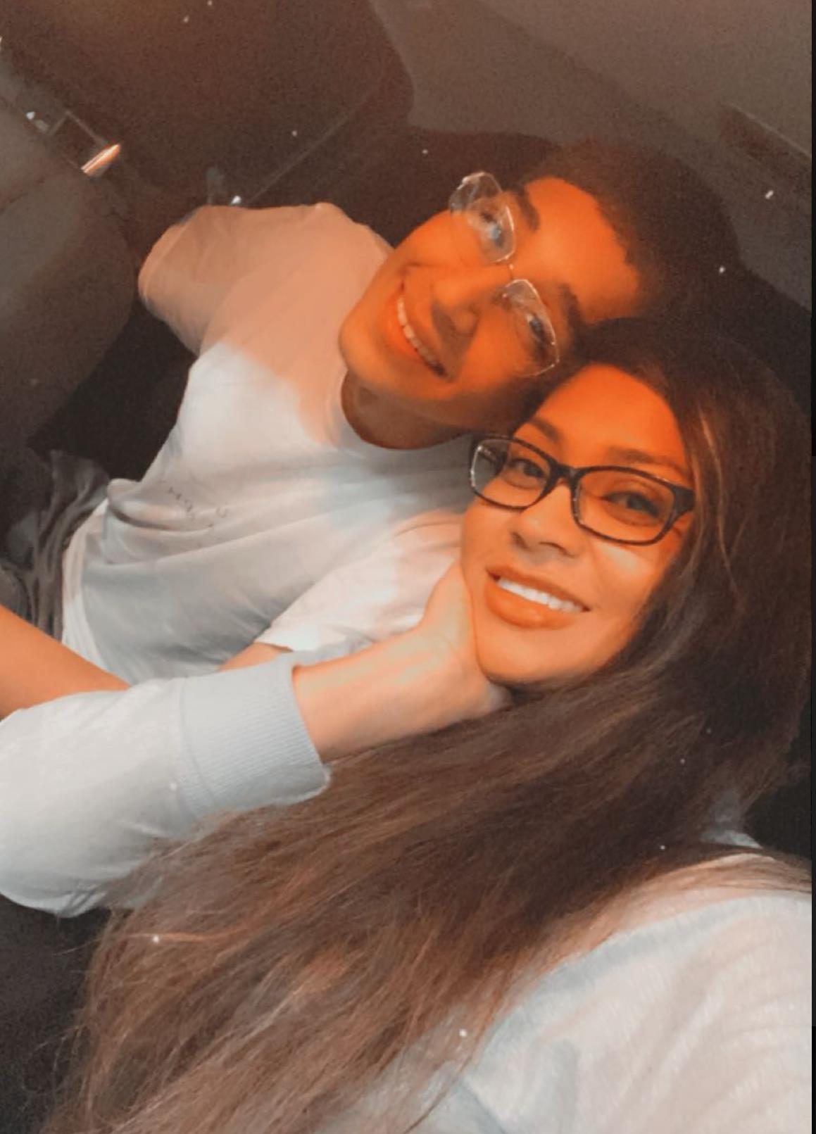 A man and woman taking a selfie