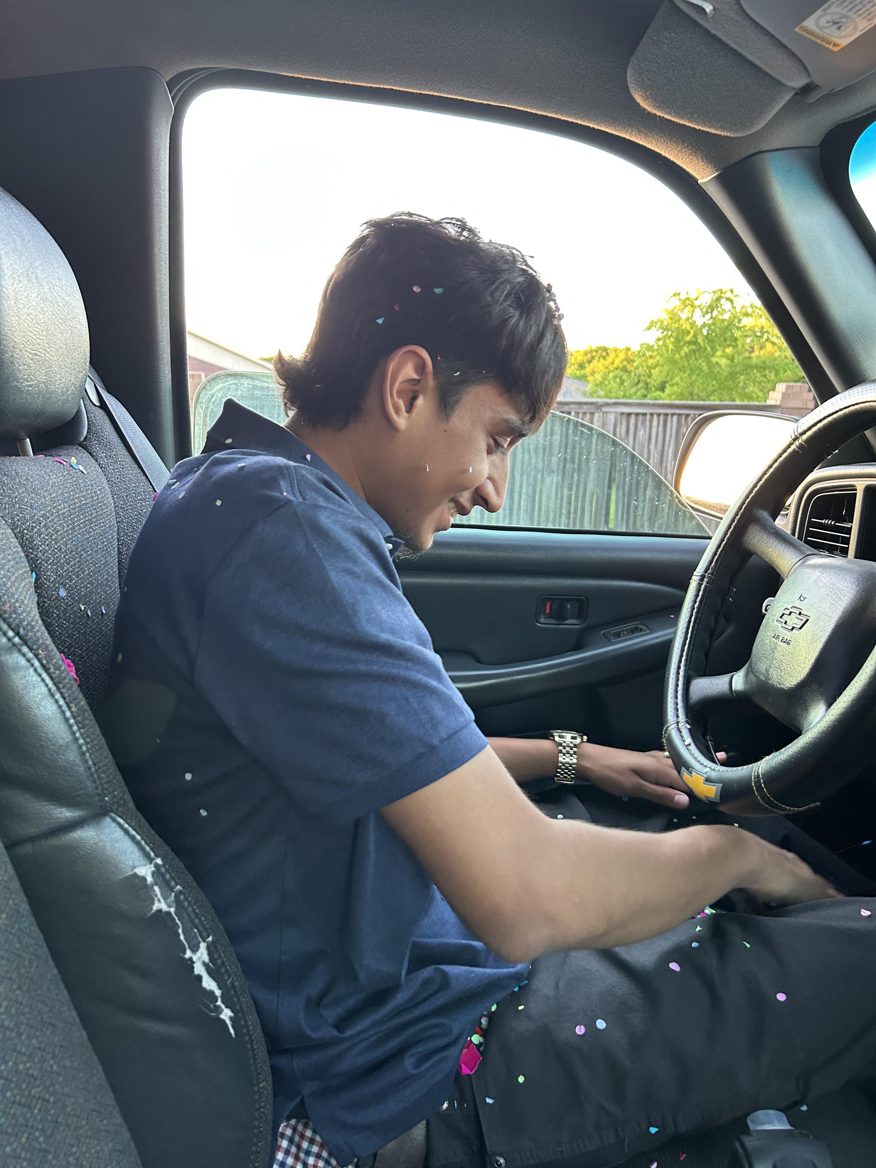 A man sitting in a car