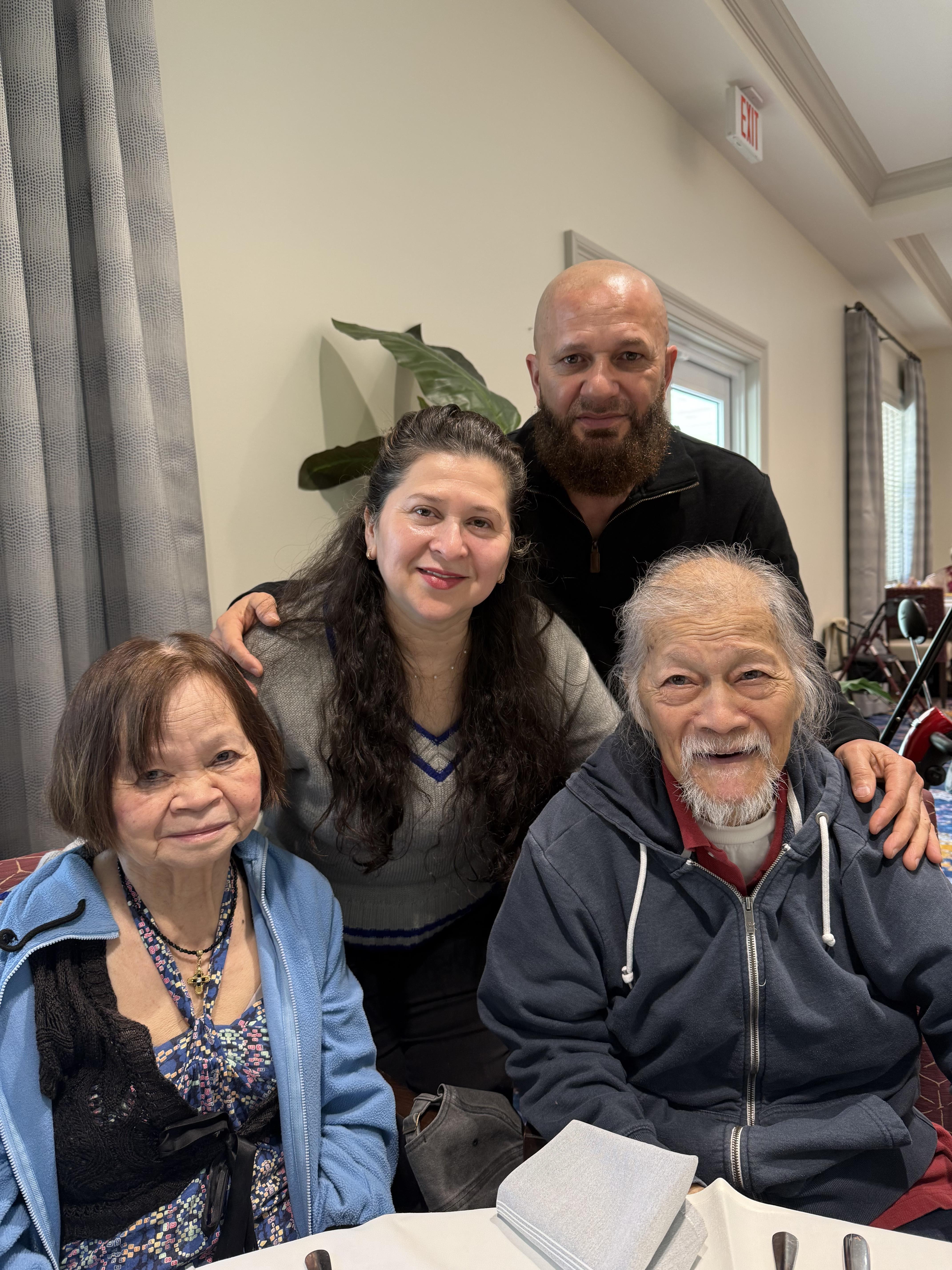 A warm moment shared among four family members celebrating a special occasion together.