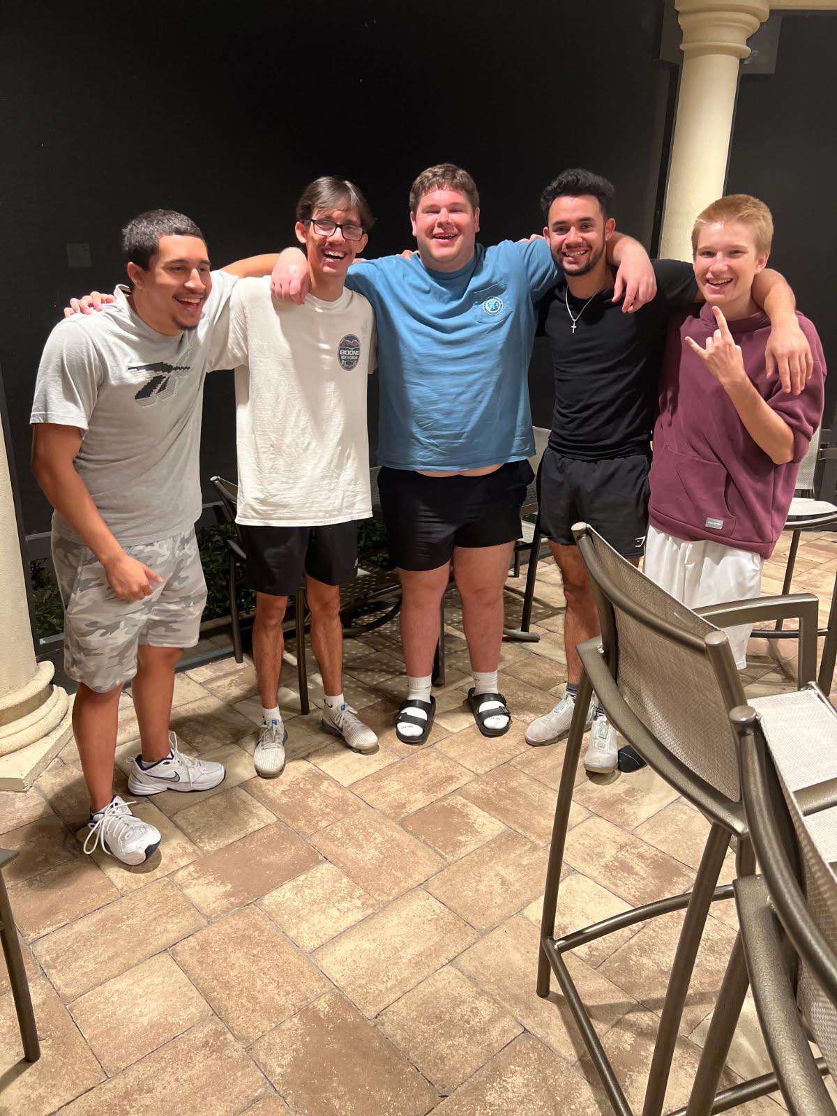 A group of men posing for a picture