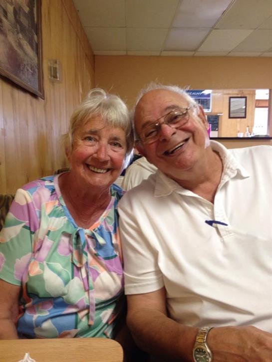 A man and woman smiling for a picture