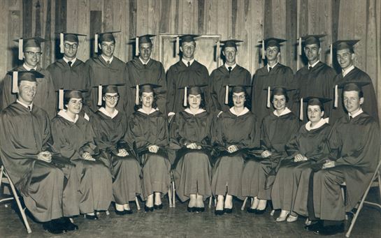 A group of people in graduation gowns