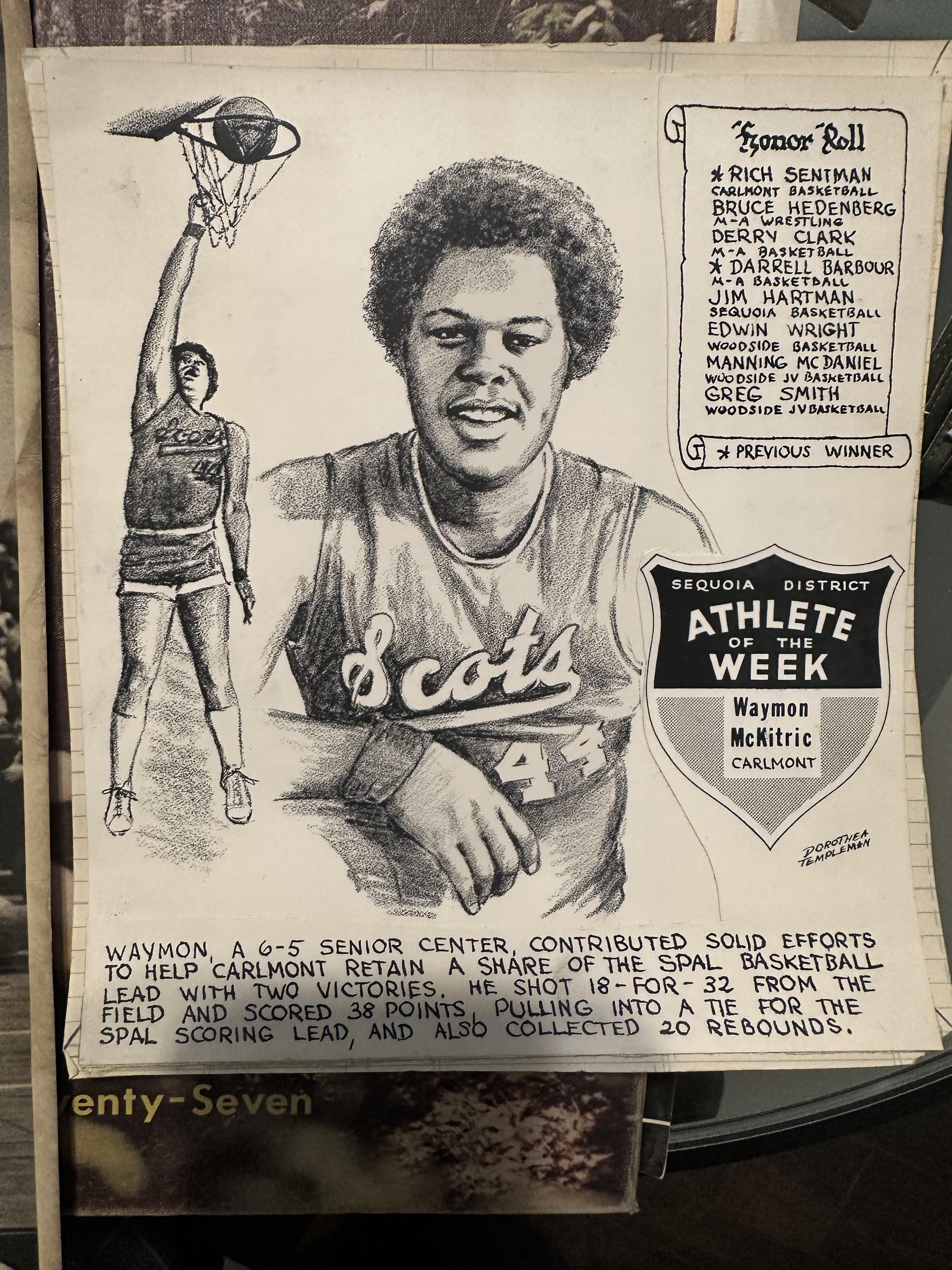 A senior basketball player celebrates a trophy for a major high school achievement.