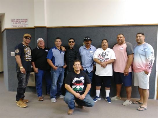 A group of men posing for a photo