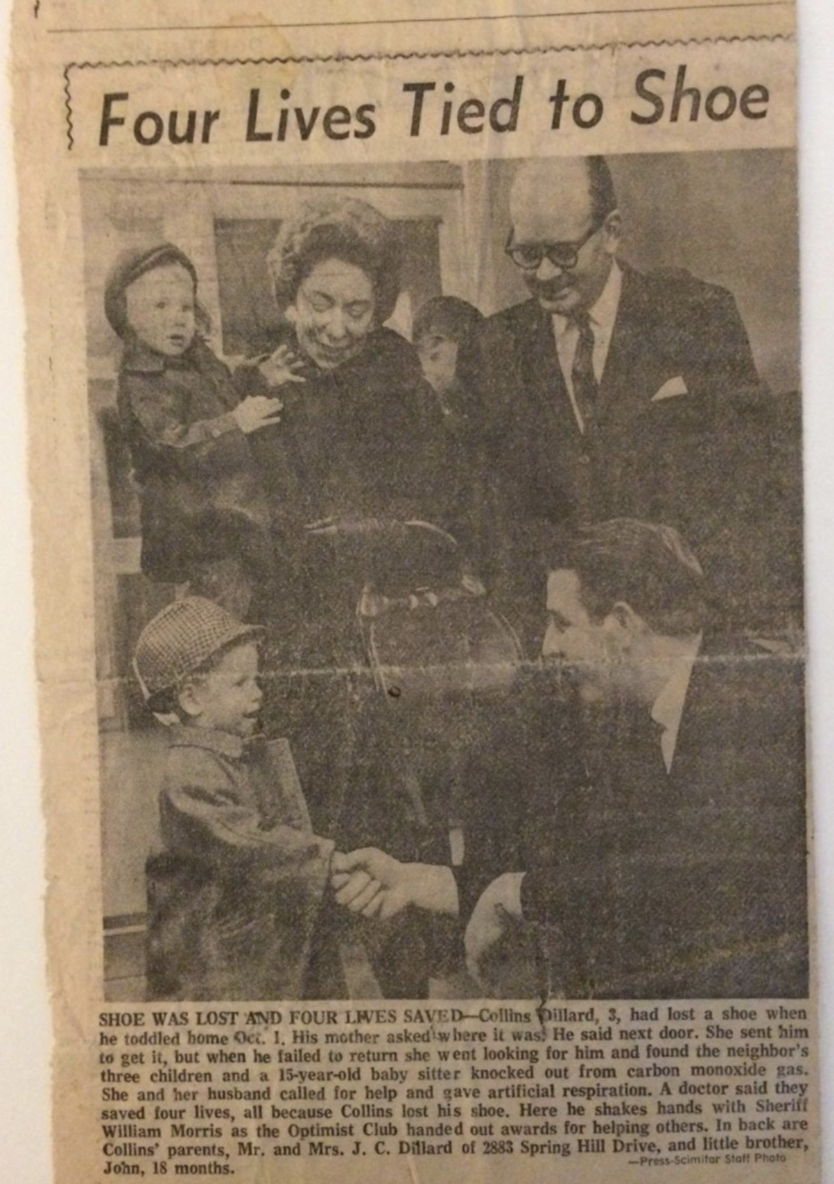 Adults warmly engage with children at a community event, sharing joy and connection.