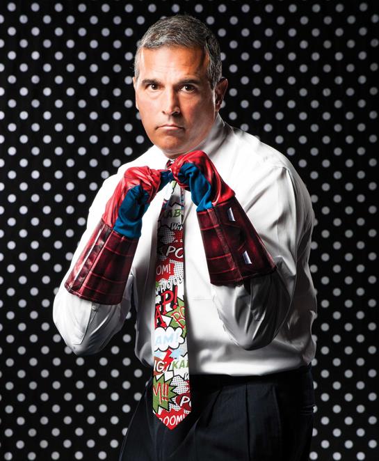 A man wearing boxing gloves and tie