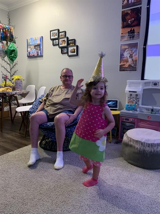 A child and a man in a room