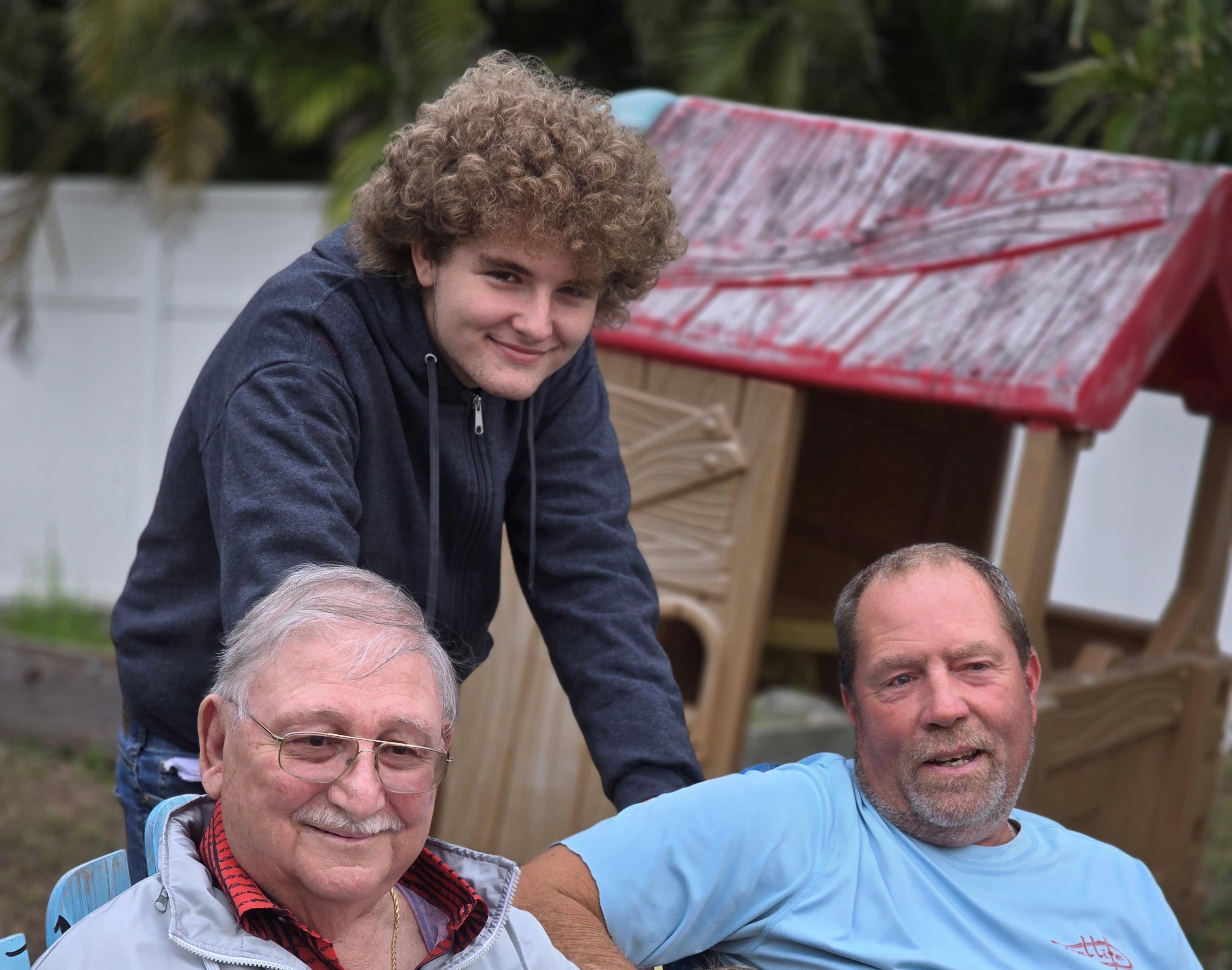 Family members joyfully connect and laugh together in the backyard.