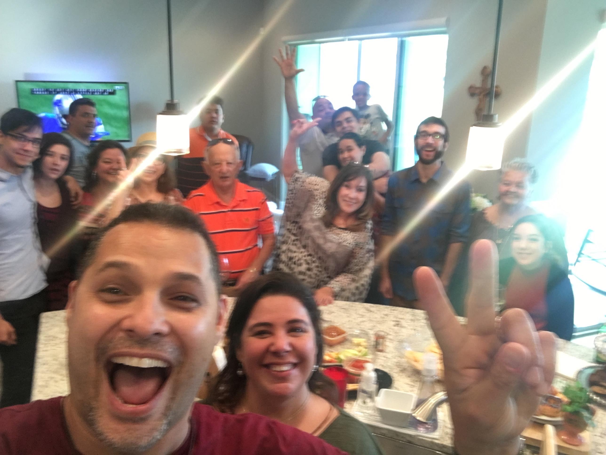 Friends gather for a cheerful celebration, sharing smiles and joy in a lively atmosphere.