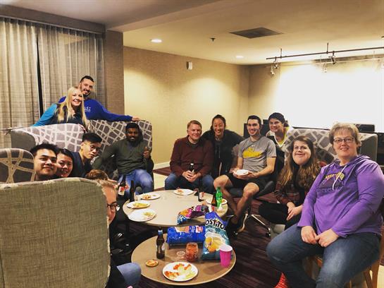 A group of people sitting around a table