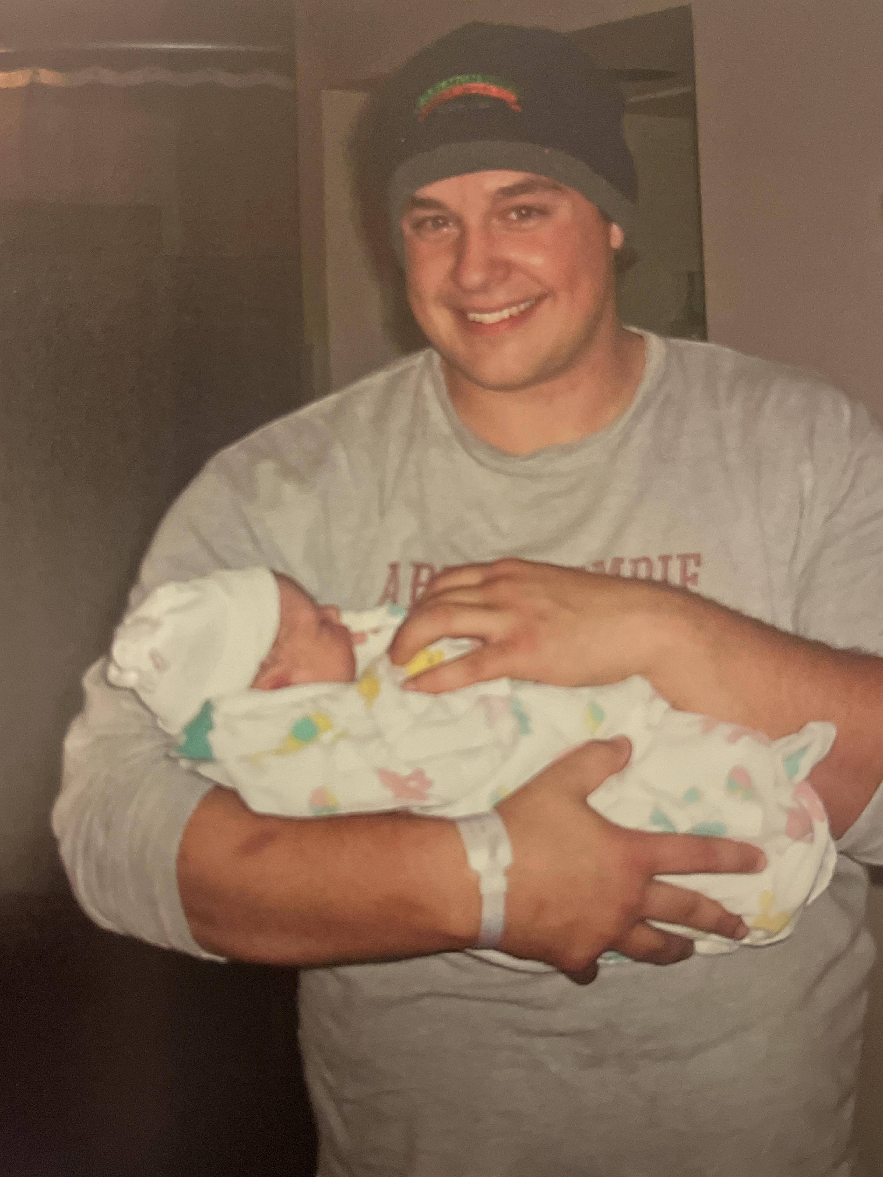 A man holding a baby