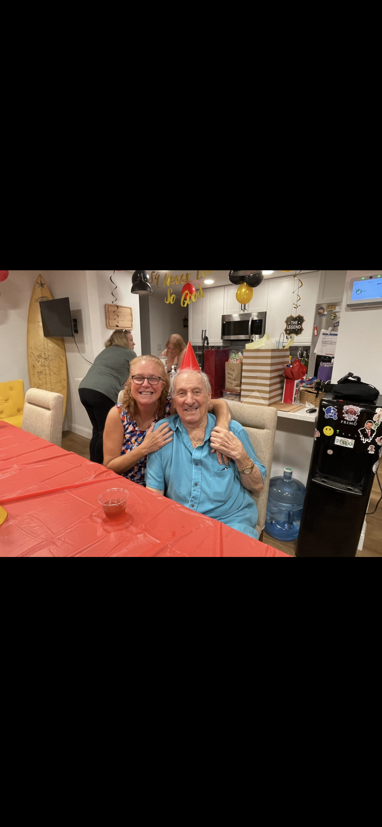 Friends and family gather in a joyful gathering, celebrating with smiles, decorations, and treats.