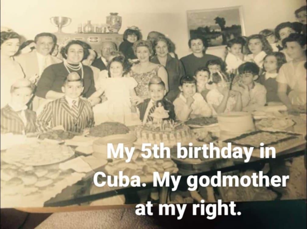 A lively birthday celebration with family and friends in Cuba, showcasing laughter and joy.