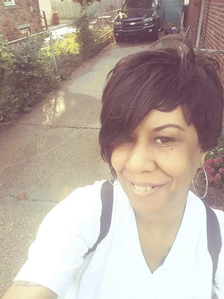 A woman smiling for a selfie
