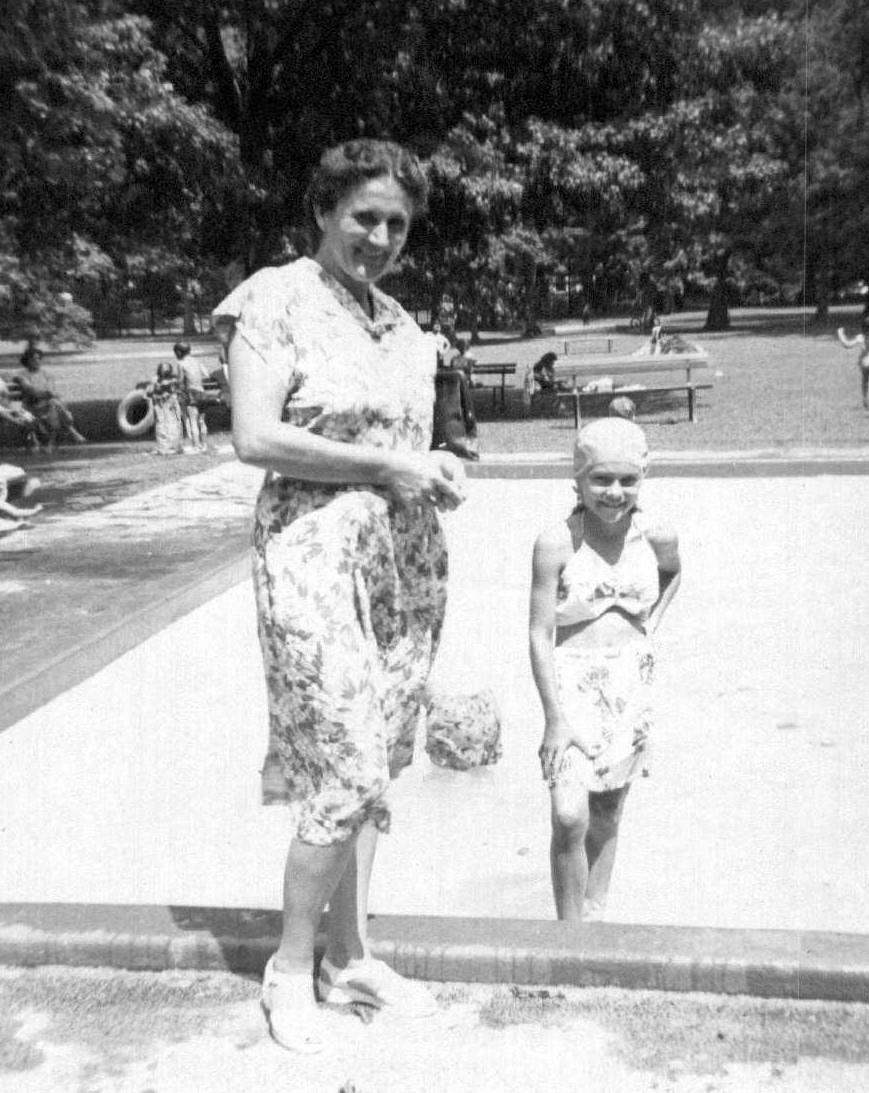 Women and children spend quality time together at a sunny park, enjoying swimming and laughter.