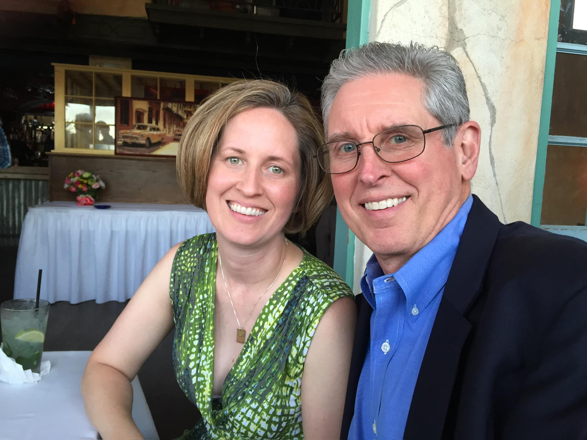 Couple enjoys a delightful evening at a restaurant, sharing smiles and warm conversation.