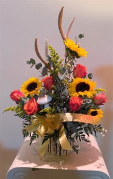 A bouquet of flowers with antlers