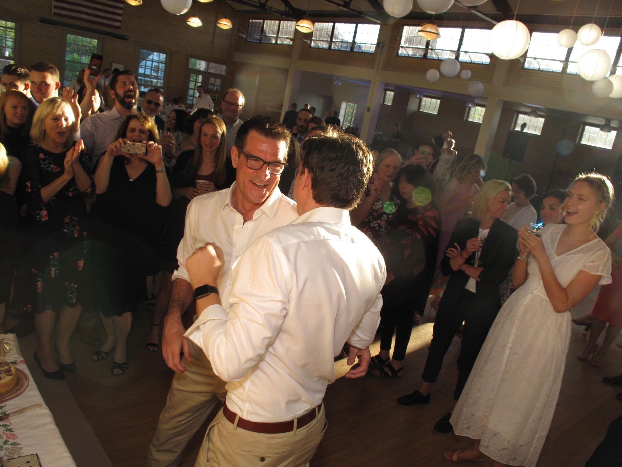 A man hugging another man