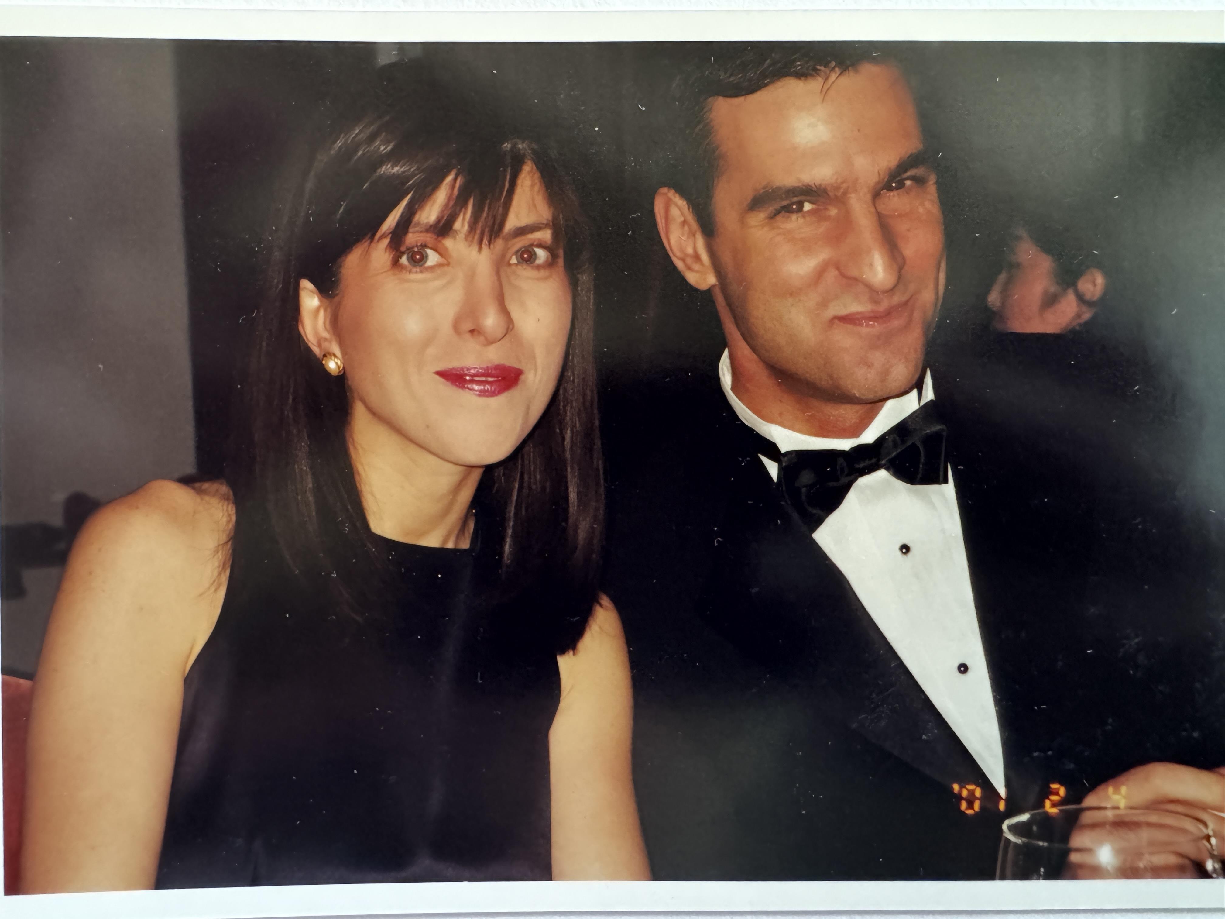 A man and woman posing for a picture