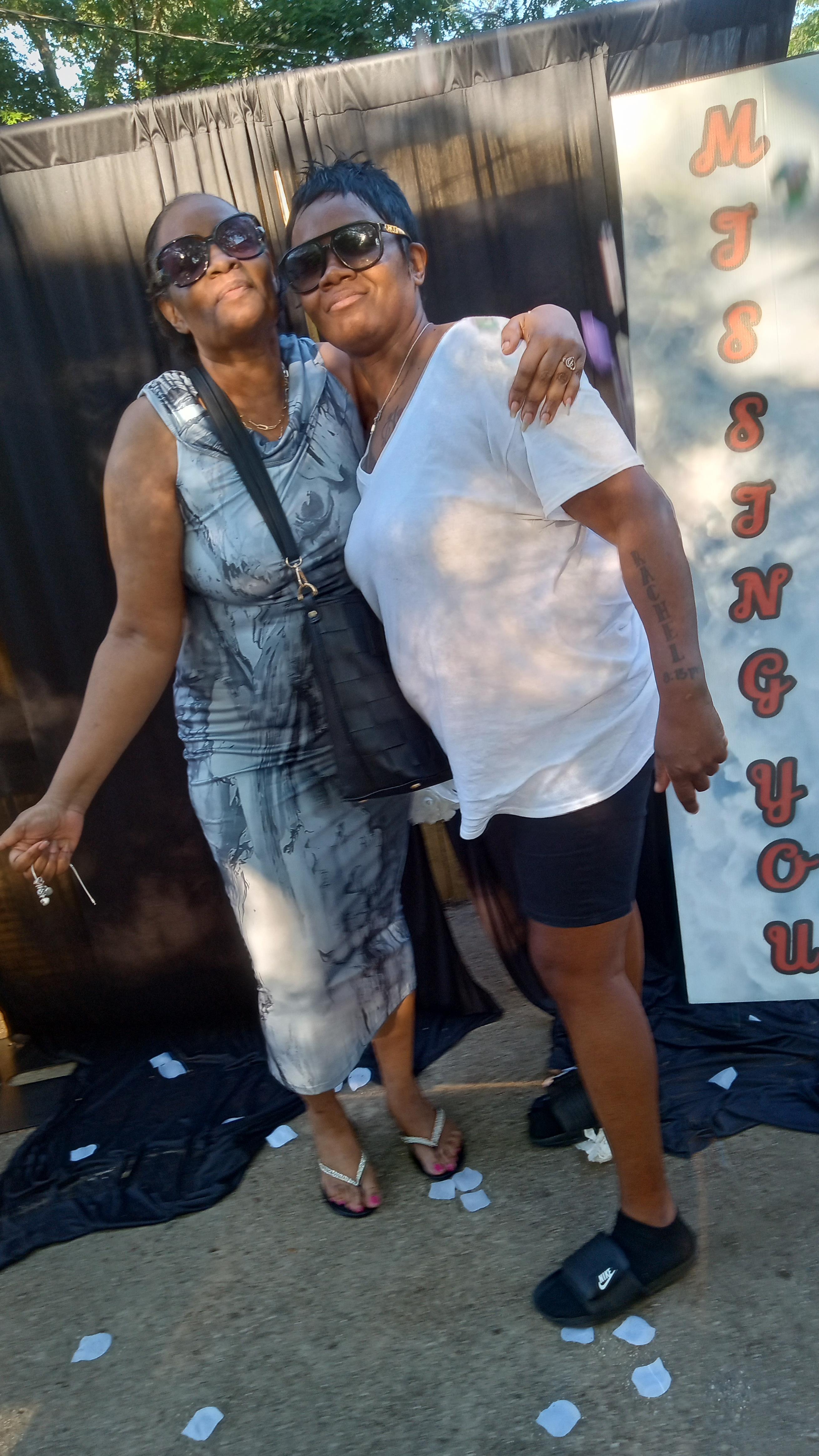 Two women standing together smiling