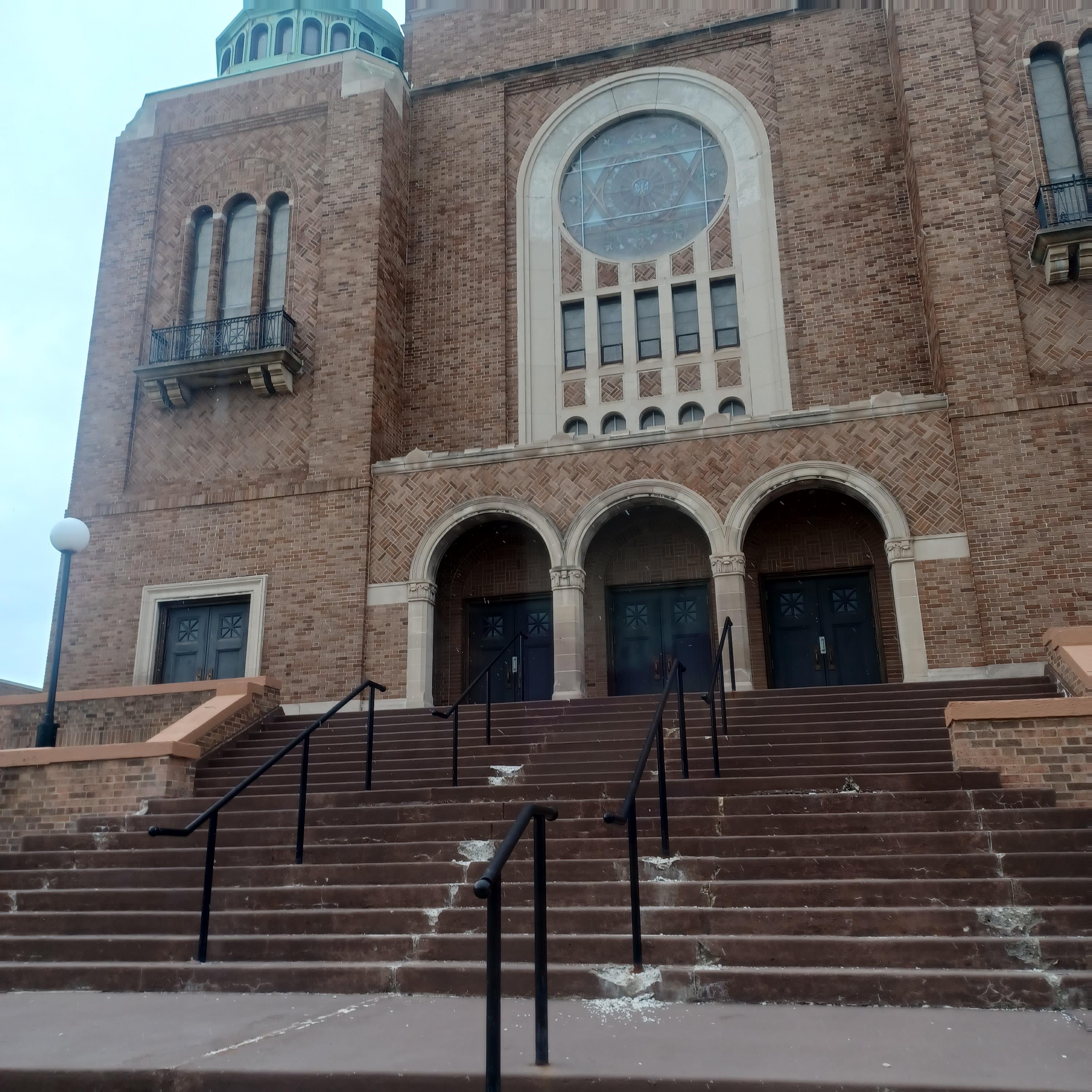 A building with stairs leading up to the front