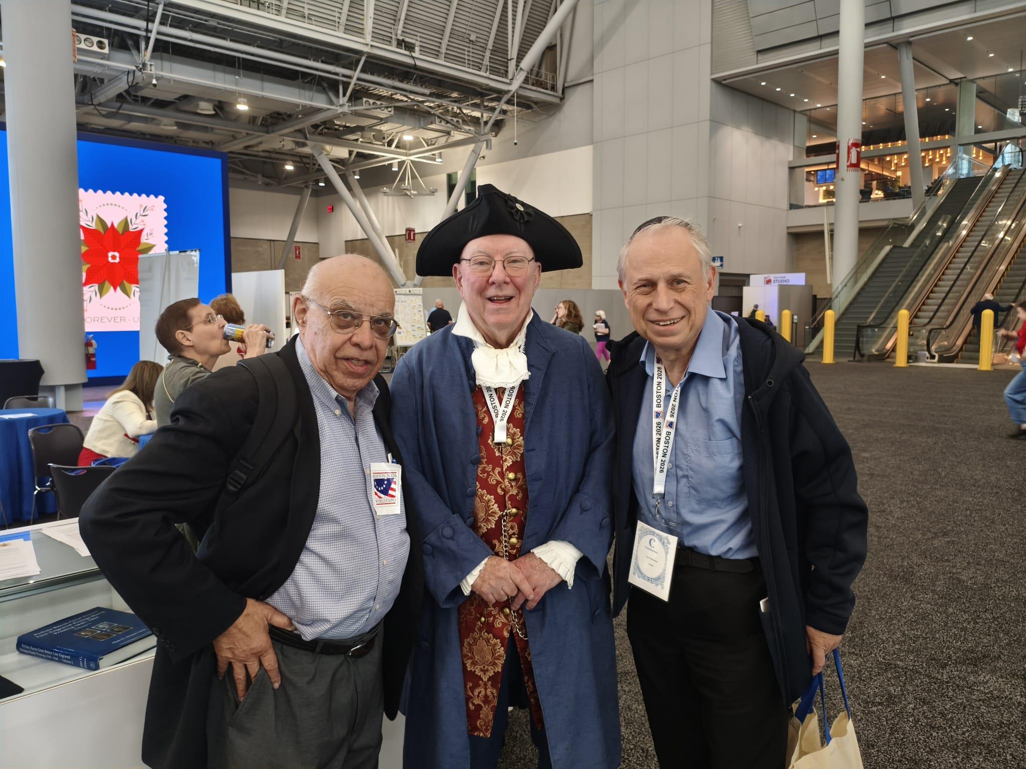 A group of men posing for a photo