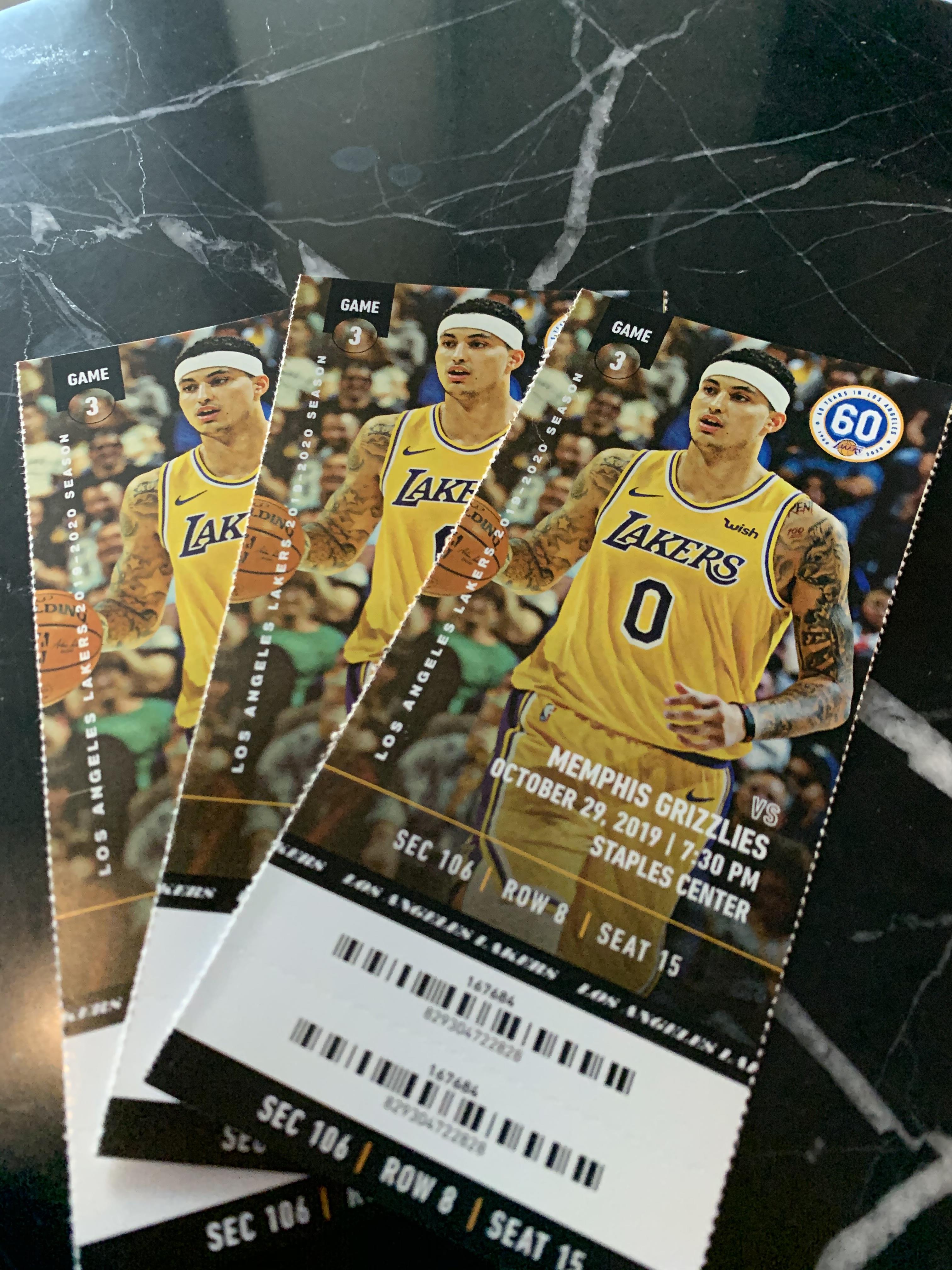 Three tickets show the Lakers and Grizzlies game details at Staples Center on October 27.