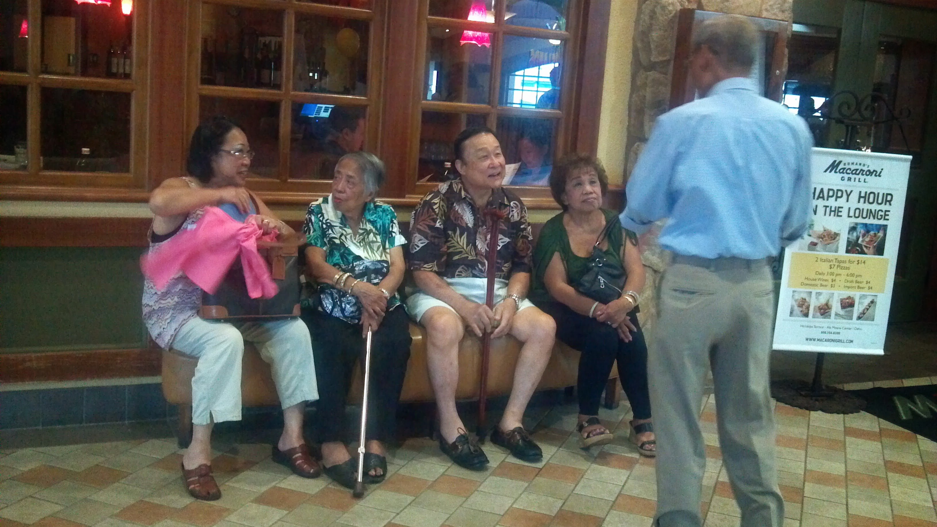 Seniors share stories in a warm space, fostering connections and laughter.