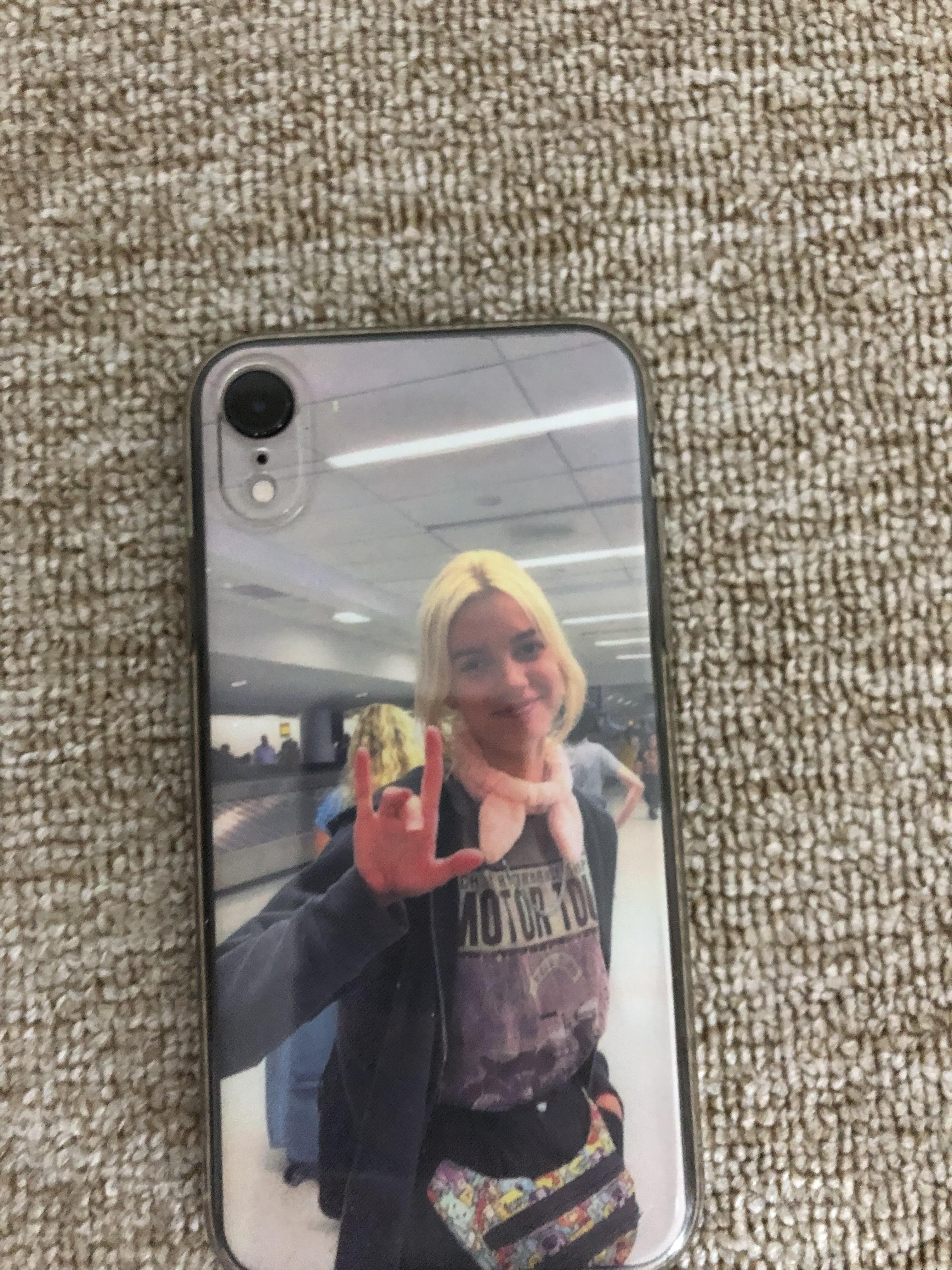 A phone case with a woman's hand on it