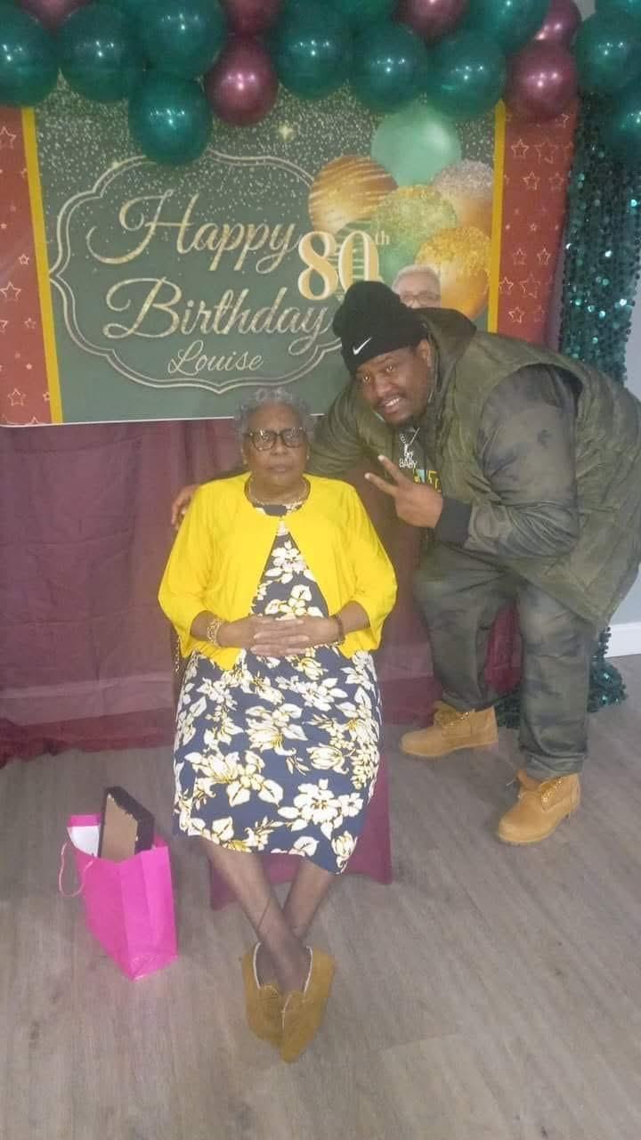 Family gathers to celebrate an 80th birthday with joy and love in a festive setting.