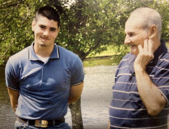 A man and a man smiling