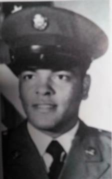 A uniformed police officer poses proudly for a formal portrait, highlighting dedication to duty.
