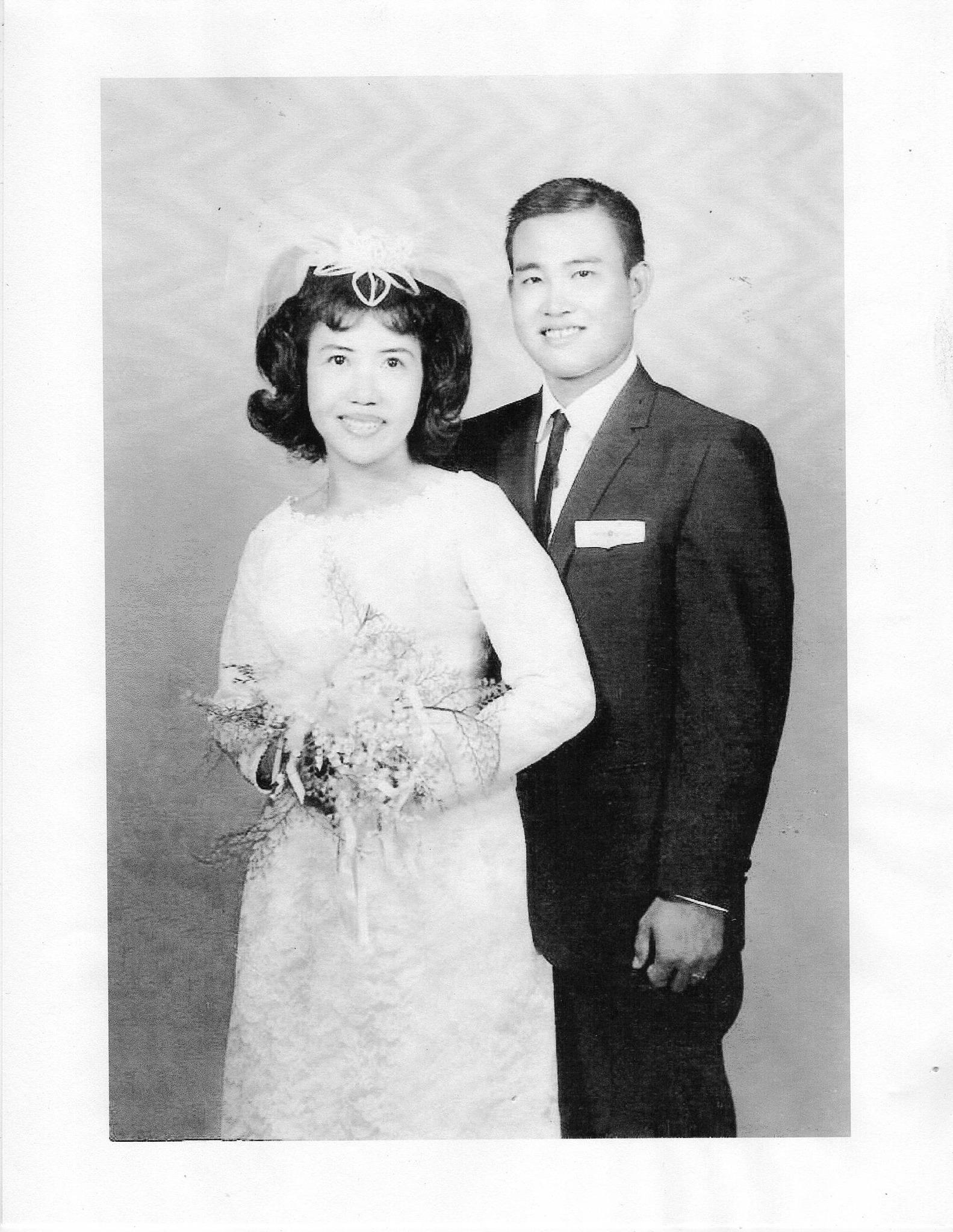 A man and woman posing for a picture