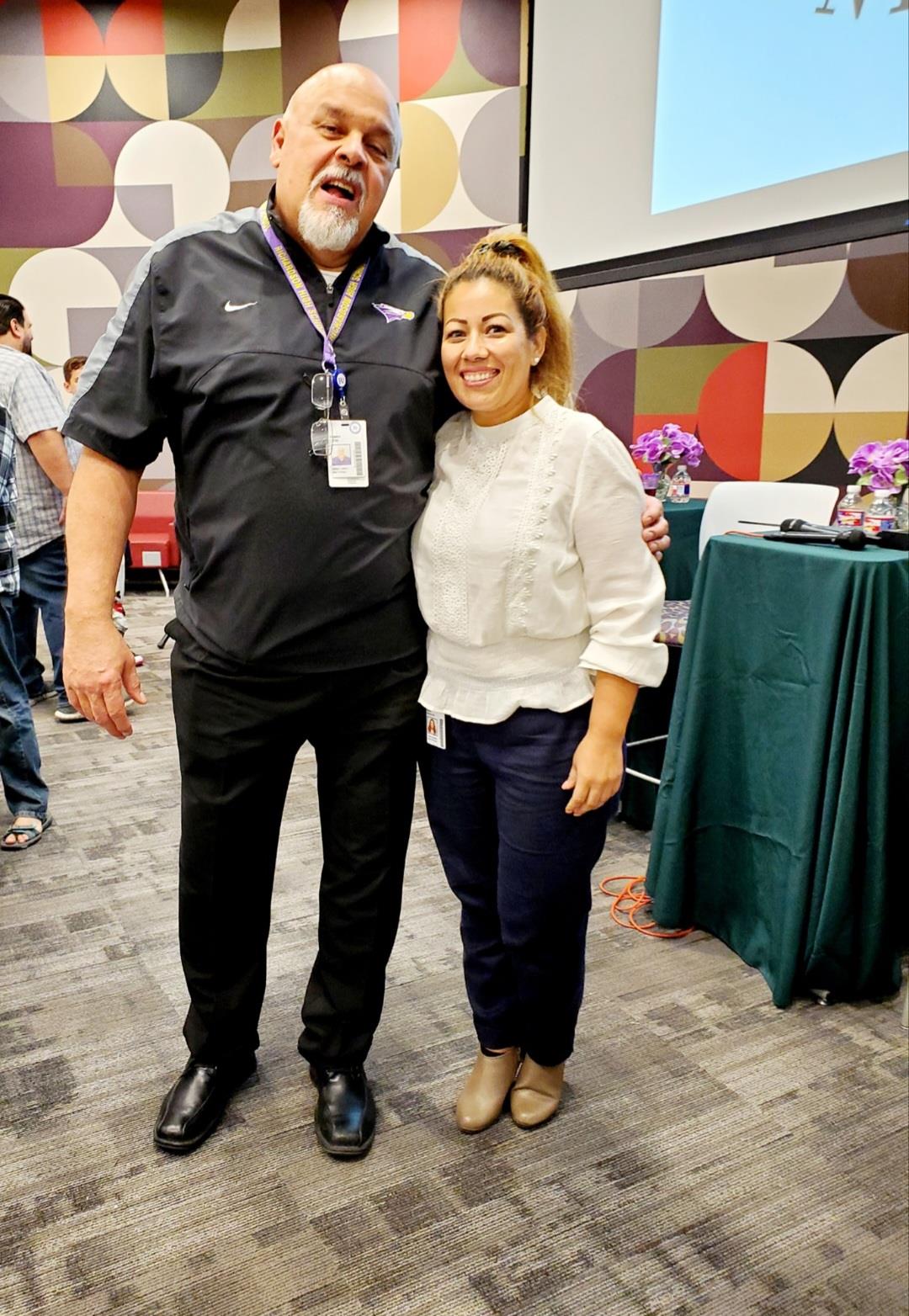 A group of professionals gathers in a conference room for networking and discussions.
