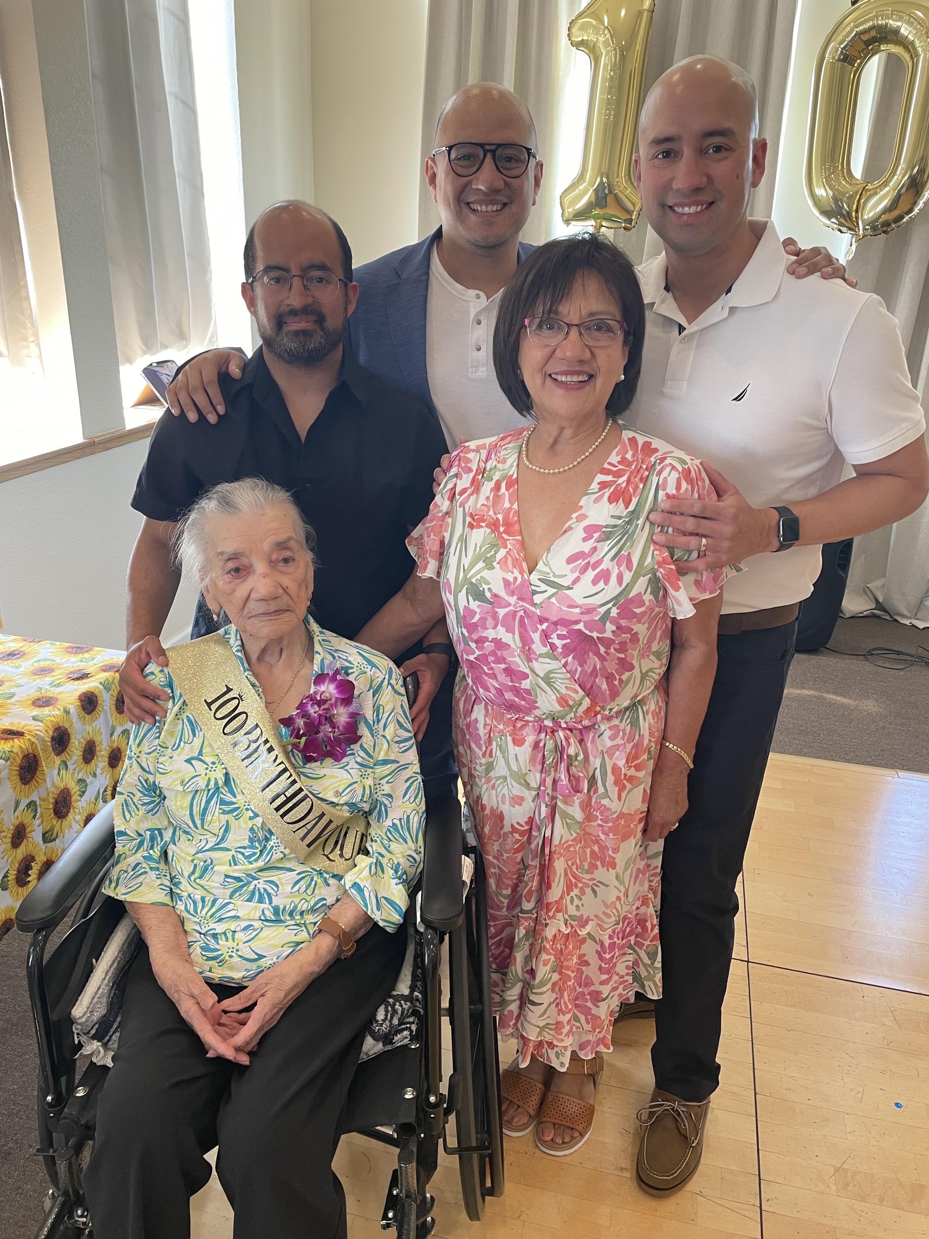 A family celebration marks the 100th birthday of a beloved woman surrounded by her loved ones.