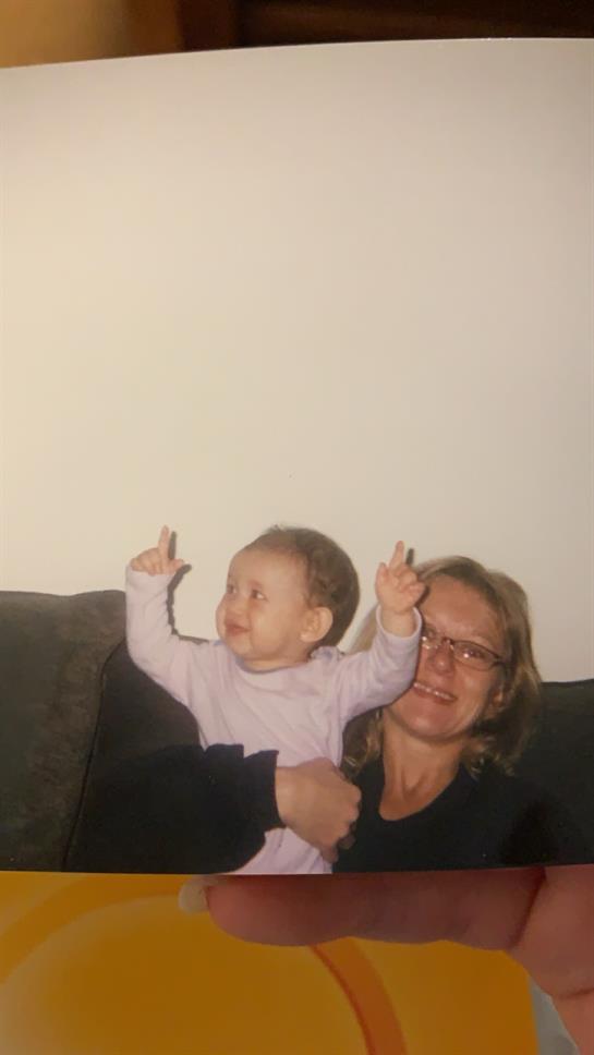 A woman holding a baby