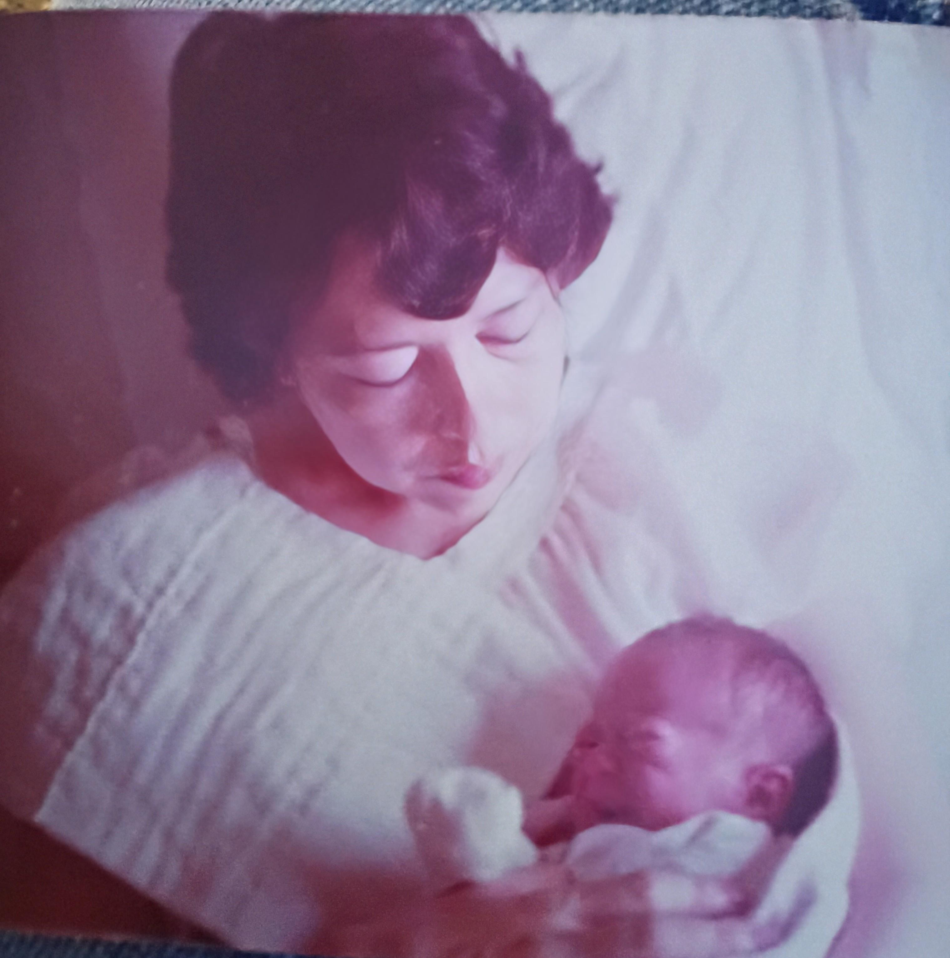 A woman holding a baby