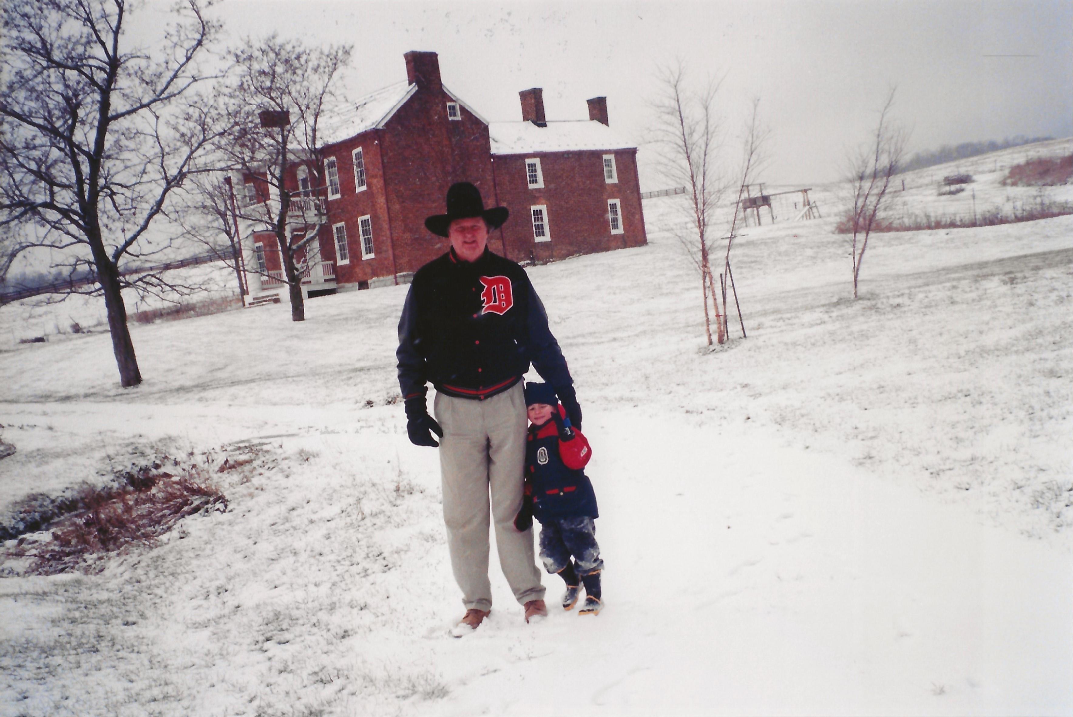 A man and child in the snow