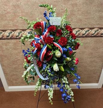 A bouquet of flowers on a stand