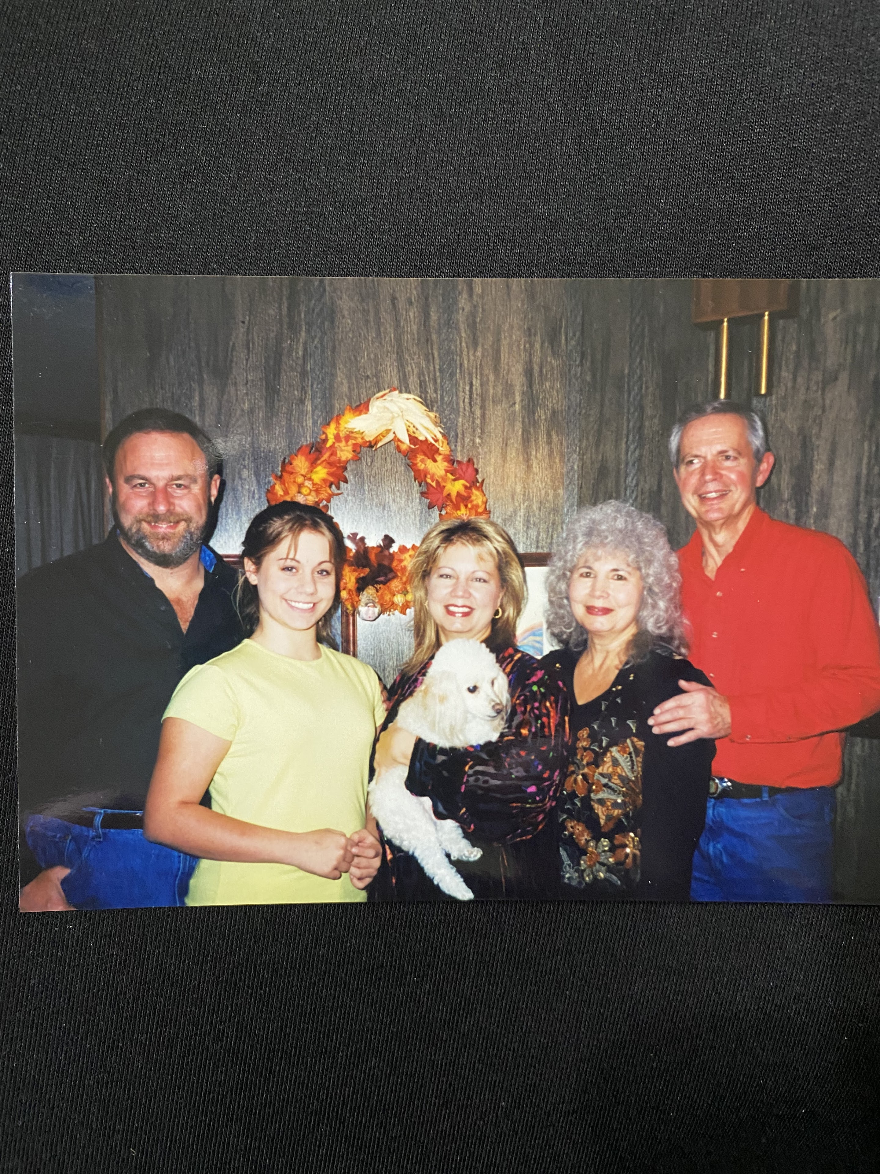 Group of friends and family enjoy a joyful moment together while celebrating autumn festivities.