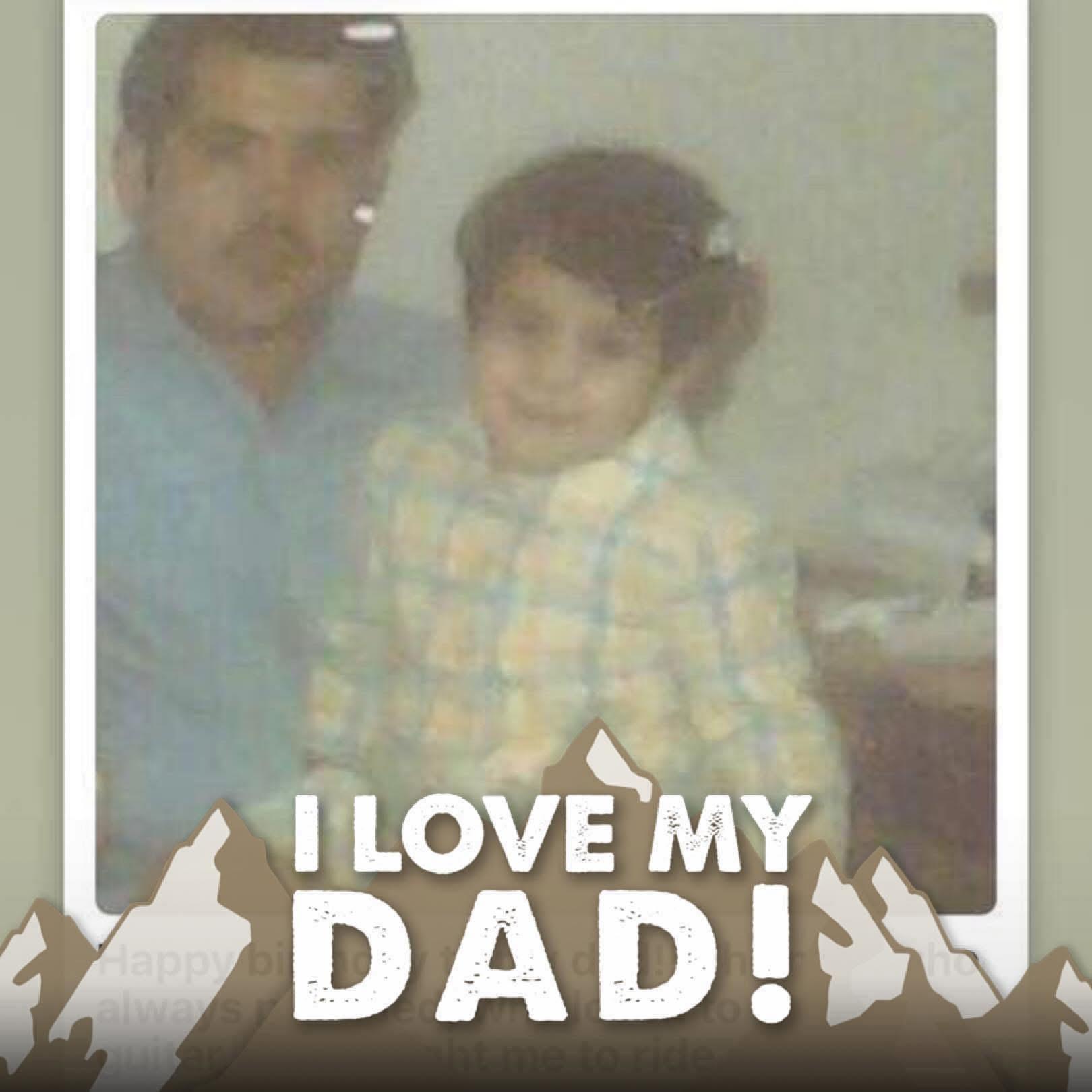 A young child embraces their father with joy, showcasing love in an intimate family moment.