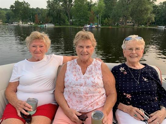 A group of women sitting on a boat